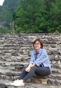 Picture of Qian Luo sitting on stone steps